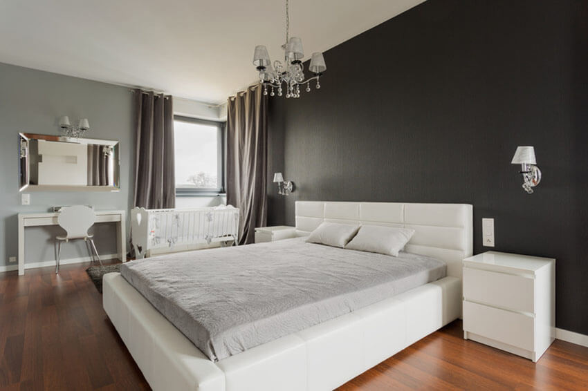 спальня с серыми и насыщенными чёрными стенами